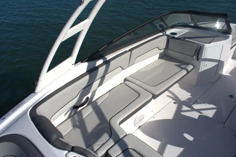 Slide: The Image of 2025 Yamaha Boats AR190 interior with sleek seating and modern design on the water. - 14
