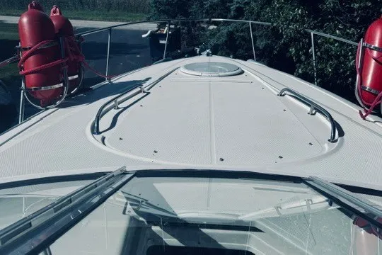 Slide: The Image of 2004 Monterey 298SC Super Sport boat deck with safety equipment and railing. - 3