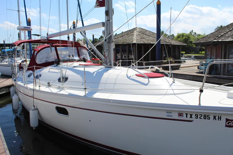 Slide: The Image of 2003 Dufour Gib Sea 37 sailboat docked at a marina. - 9