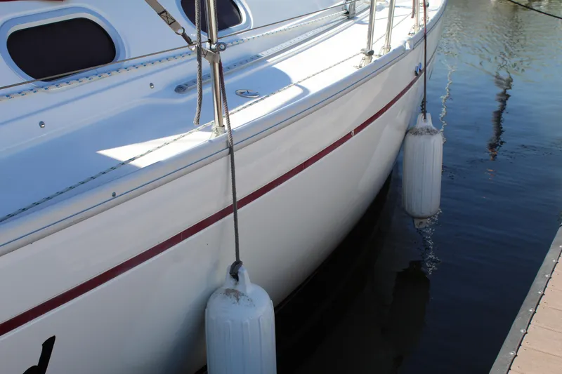 Slide: The Image of 2003 Dufour Gib Sea 37 sailboat docked with fenders. - 6