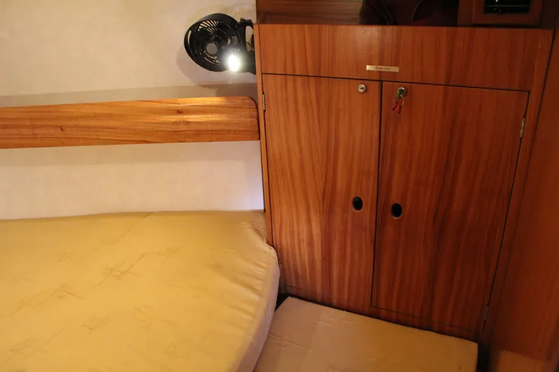 Slide: The Image of Interior cabin of 2003 Dufour Gib Sea 37 sailboat with wooden storage and bed. - 34