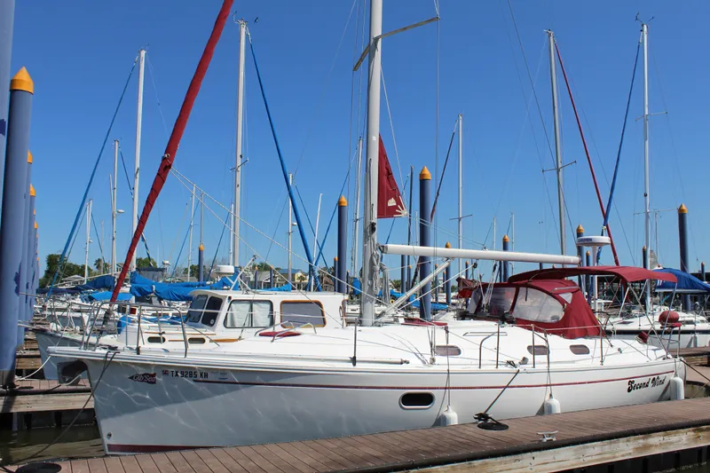 Slide: The Image of 2003 Dufour Gib Sea 37 sailboat docked at marina with blue sky. - 1