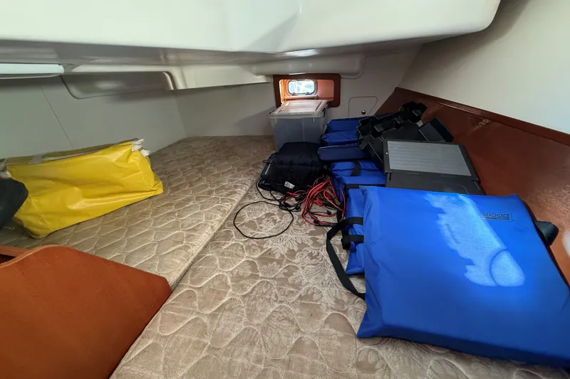 Slide: The Image of Interior cabin of 2006 Beneteau Oceanis 343 with storage items and equipment. - 24