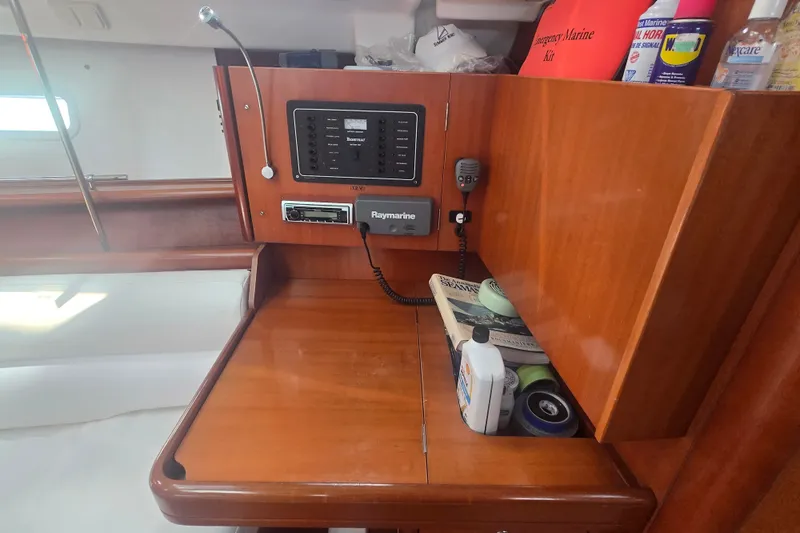 Slide: The Image of Interior of 2006 Beneteau Oceanis 343 sailboat with navigation equipment and storage. - 18