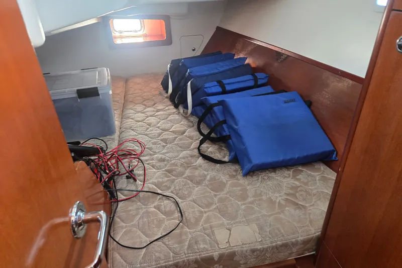 Slide: The Image of Interior cabin of 2006 Beneteau Oceanis 343 with storage bags and equipment. - 25