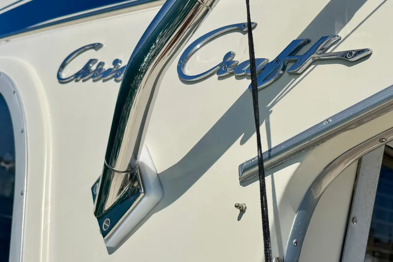 Slide: The Image of Close-up of 1985 Chris-Craft 382 Commander boat logo and chrome details. - 79