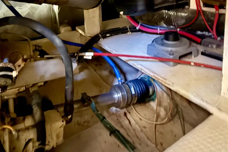 Slide: The Image of Engine compartment of a 1985 Chris-Craft 382 Commander with visible wiring and components. - 84