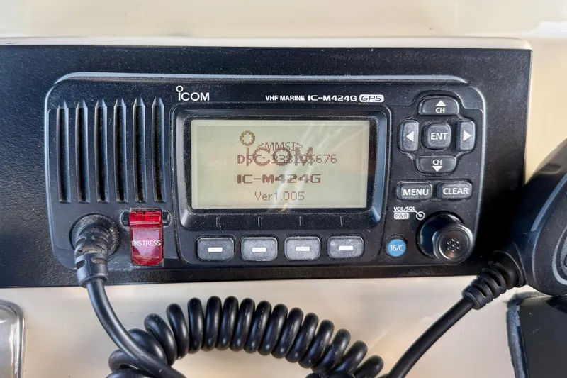 Slide: The Image of VHF marine radio IC-M424G on 1985 Chris-Craft 382 Commander boat dashboard. - 65