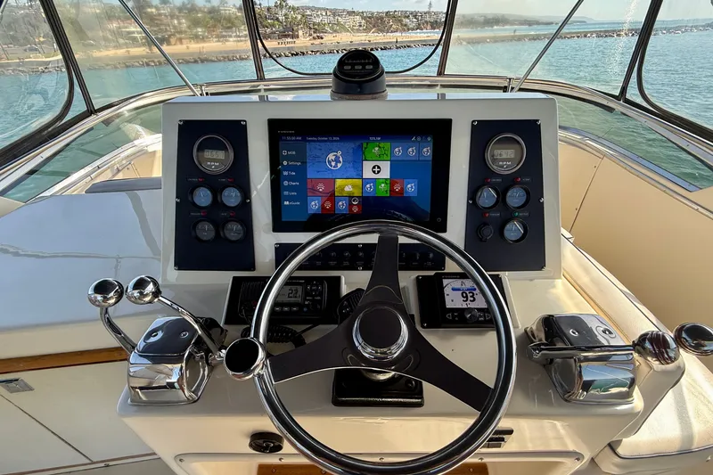 Slide: The Image of Helm of 1985 Chris-Craft 382 Commander with modern navigation system and controls. - 66
