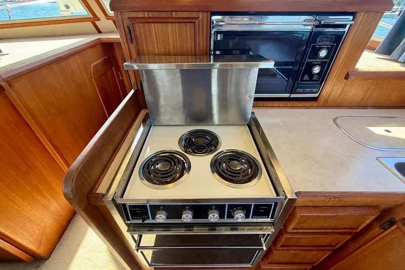 Slide: The Image of 1985 Chris-Craft 382 Commander yacht kitchen with stove and microwave. - 24