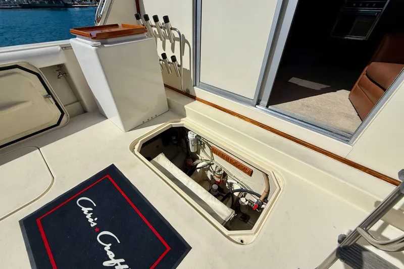 Slide: The Image of 1985 Chris-Craft 382 Commander yacht deck with open hatch and interior view. - 80
