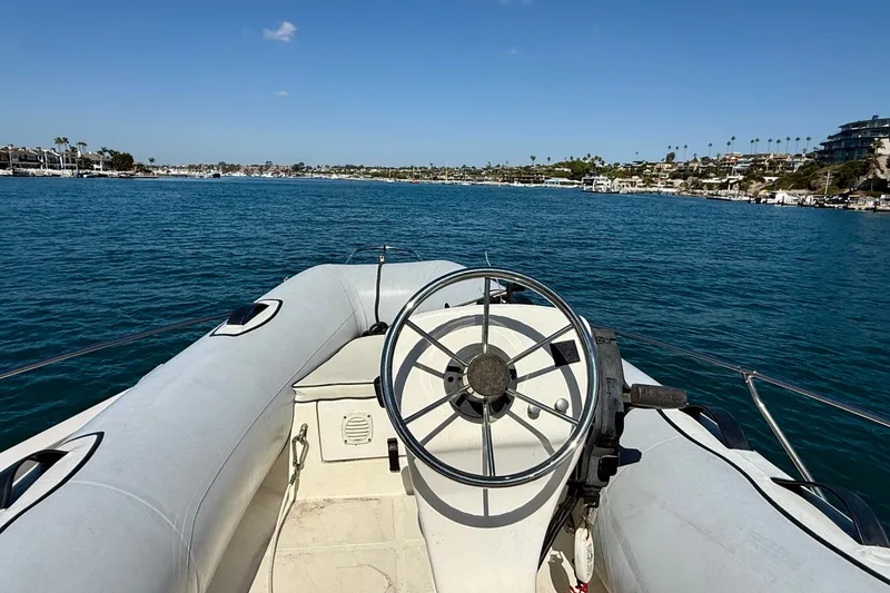 Slide: The Image of 1985 Chris-Craft 382 Commander boat steering view on calm blue water. - 70