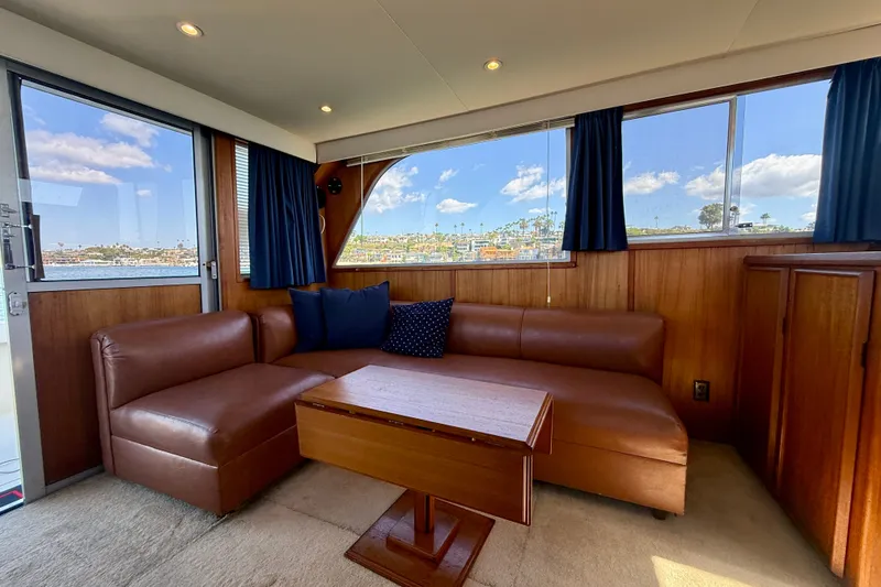Slide: The Image of Luxurious interior of 1985 Chris-Craft 382 Commander yacht with leather seating and scenic views. - 14