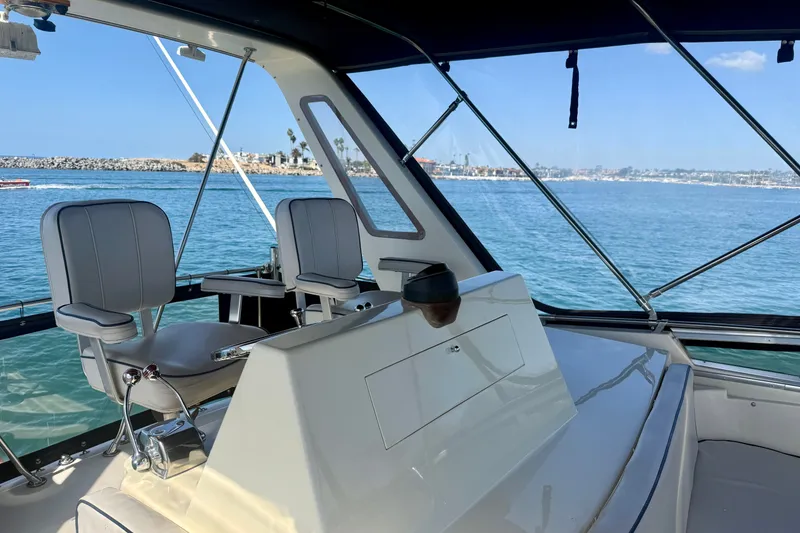 Slide: The Image of 1985 Chris-Craft 382 Commander boat interior with ocean view and seating. - 56