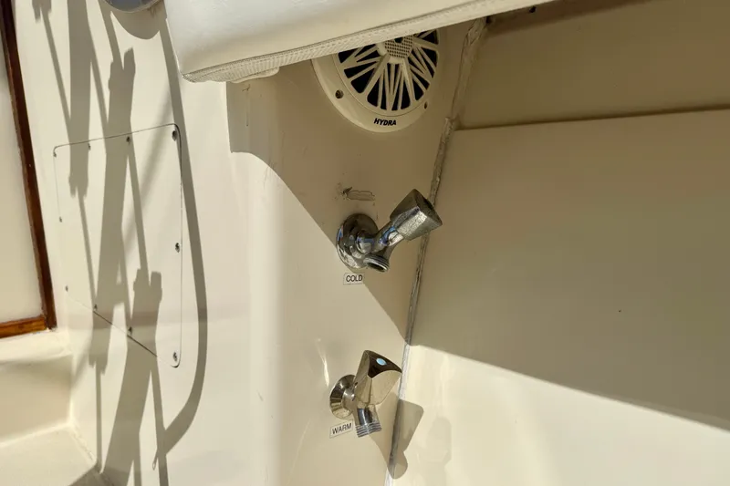 Slide: The Image of 1985 Chris-Craft 382 Commander boat interior with cold and warm water controls. - 76