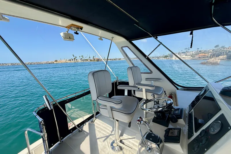 Slide: The Image of Interior view of 1985 Chris-Craft 382 Commander yacht with ocean backdrop. - 58