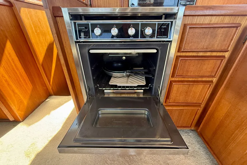 Slide: The Image of Oven in 1985 Chris-Craft 382 Commander yacht kitchen, with wooden cabinetry. - 28