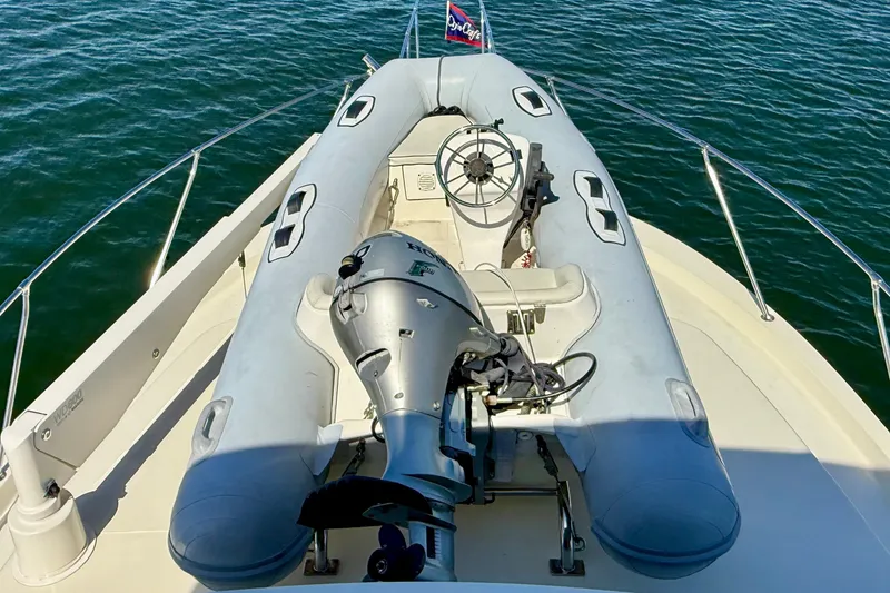 Slide: The Image of 1985 Chris-Craft 382 Commander with inflatable dinghy and outboard motor on deck. - 75