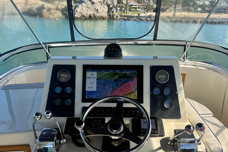 Slide: The Image of Helm of 1985 Chris-Craft 382 Commander with navigation display and controls. - 55