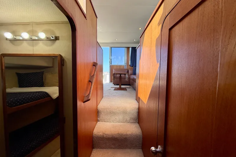Slide: The Image of Interior of 1985 Chris-Craft 382 Commander yacht with wood paneling and cozy cabin. - 36