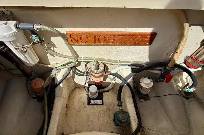 Slide: The Image of Engine compartment of 1985 Chris-Craft 382 Commander with hoses and equipment. - 81