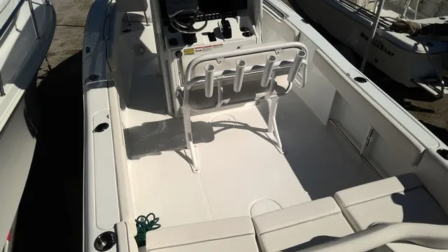 Slide: The Image of The image shows the cockpit of a 2023 Sea Hunt Ultra 229 boat with white seating. - 3