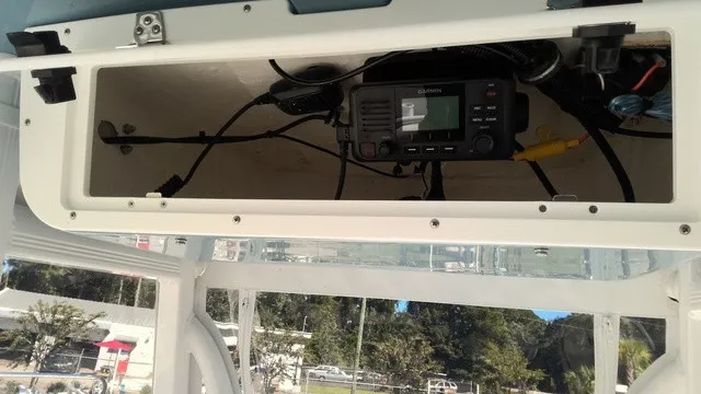 Slide: The Image of An open compartment on a boat reveals a built-in radio and wiring. - 8