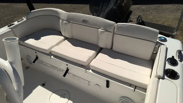 Slide: The Image of The 2023 Sea Hunt Ultra 229 features a spacious, cushioned bench seat in the rear area. - 4