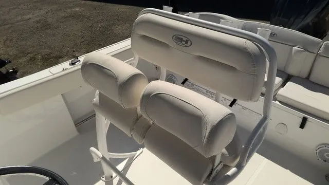 Slide: The Image of The image shows the white upholstery of the seats on a Sea Hunt Ultra 229 boat. - 5
