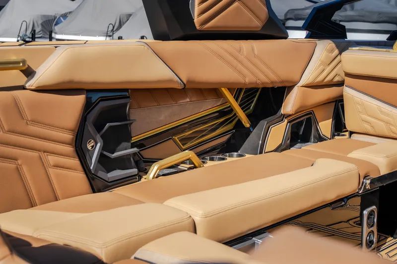 Slide: The Image of Luxurious interior of 2027 Tigé Ultré 25ZX boat with tan leather seating. - 39