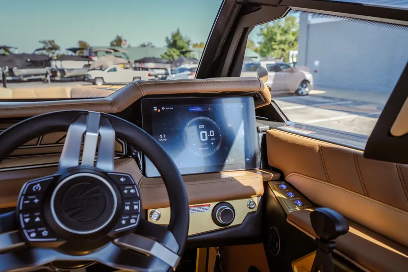 Slide: The Image of Interior view of 2027 Tigé Ultré 25ZX boat dashboard with touchscreen display. - 46