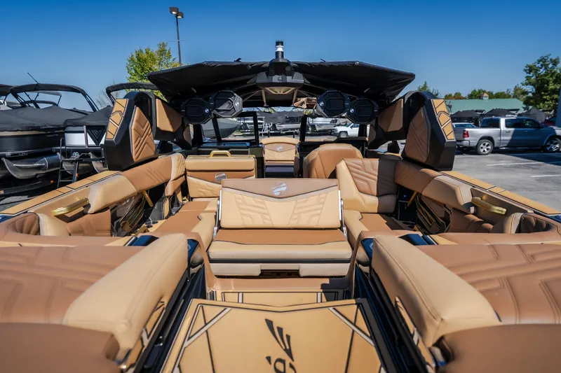 Slide: The Image of Luxurious interior of 2027 Tigé Ultré 25ZX boat with tan leather seating. - 34
