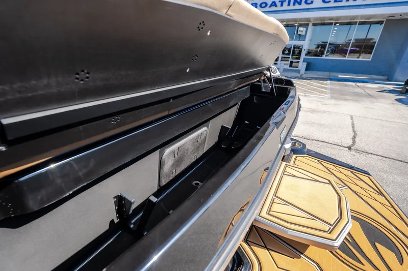 Slide: The Image of 2027 Tigé Ultré 25ZX boat storage compartment open at a boating center. - 30