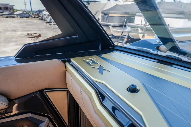 Slide: The Image of Interior detail of 2027 Tigé Ultré 25ZX boat, showcasing sleek design and luxurious materials. - 14