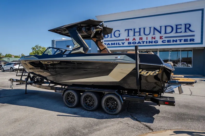 Slide: The Image of 2027 Tigé Ultré 25ZX boat on trailer at Big Thunder Marine dealership. - 3