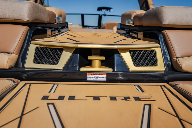 Slide: The Image of 2027 Tigé Ultré 25ZX boat interior with tan seating and stylish design elements. - 32