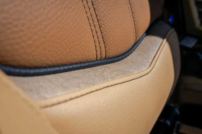 Slide: The Image of Close-up of 2027 Tigé Ultré 25ZX seat with tan leather upholstery. - 48