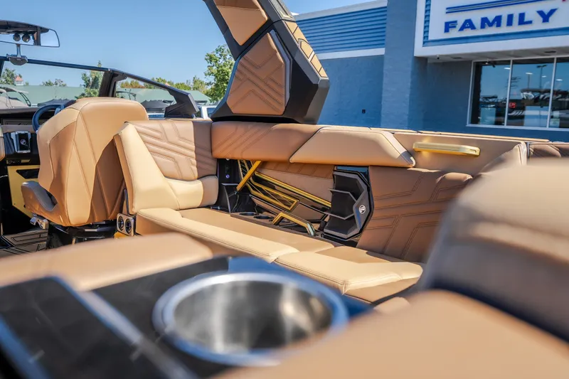 Slide: The Image of Luxurious interior of 2027 Tigé Ultré 25ZX boat with tan leather seating. - 38
