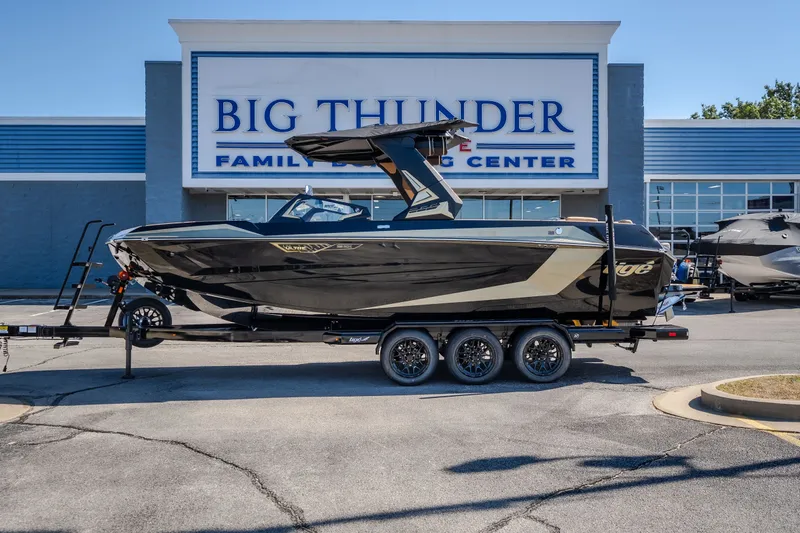 Slide: The Image of 2027 Tigé Ultré 25ZX boat on trailer at Big Thunder Family Boating Center. - 1