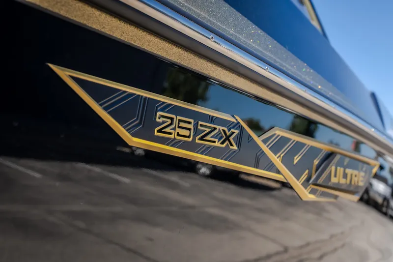 Slide: The Image of 2027 Tigé Ultré 25ZX boat with sleek design and bold graphics. - 23