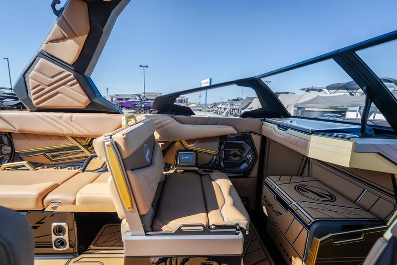 Slide: The Image of Luxurious interior of 2027 Tigé Ultré 25ZX boat with tan leather seating and modern design. - 52