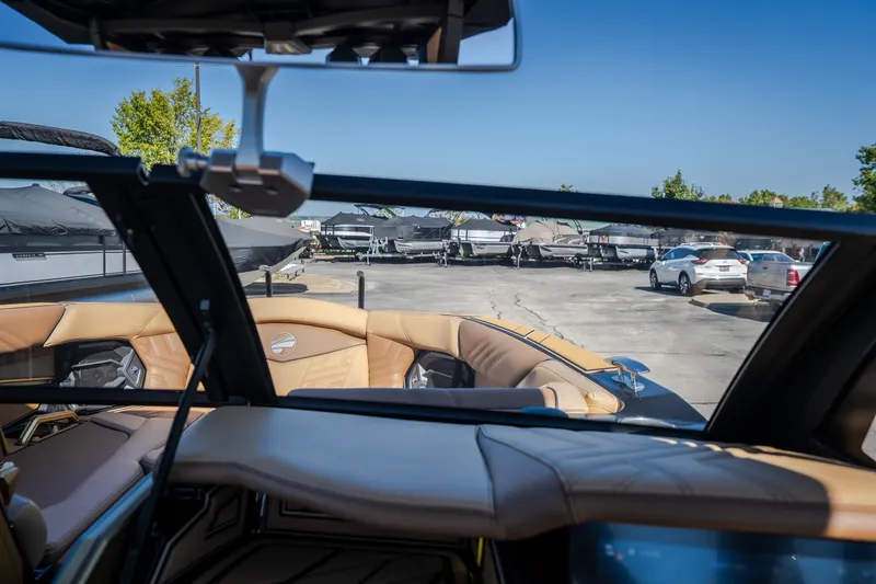 Slide: The Image of Interior view of 2027 Tigé Ultré 25ZX boat with luxurious seating and dashboard. - 50