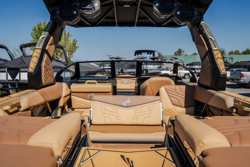 Slide: The Image of Luxurious interior of 2027 Tigé Ultré 25ZX boat with tan leather seating. - 36