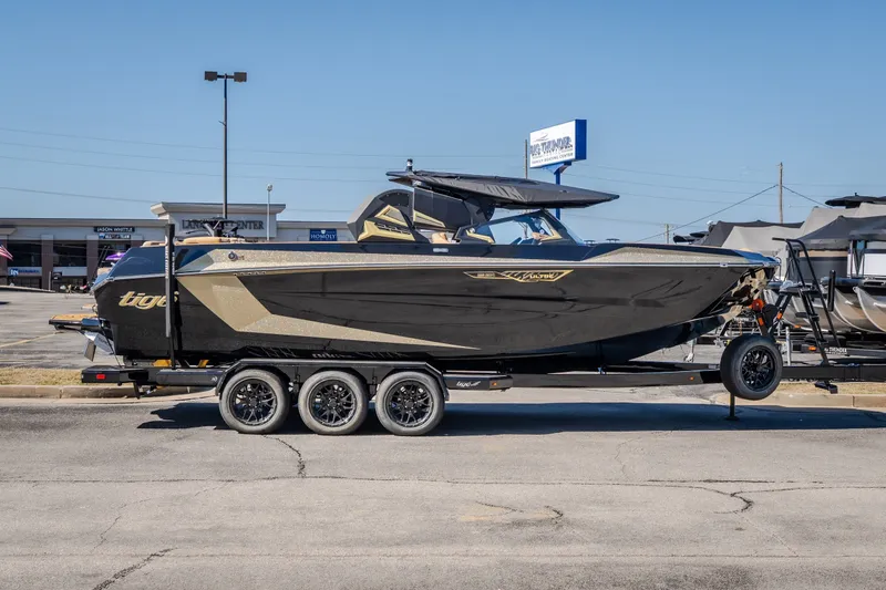 Slide: The Image of 2027 Tigé Ultré 25ZX boat on trailer in parking lot, side view. - 12