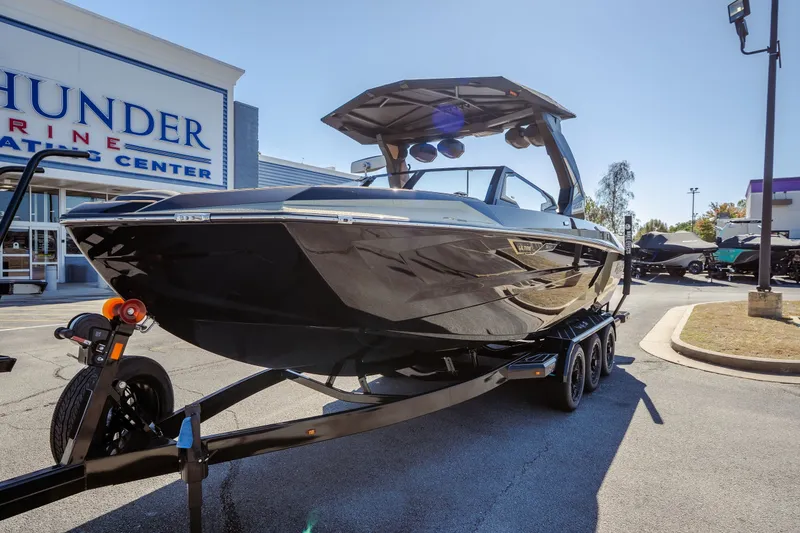 Slide: The Image of 2027 Tigé Ultré 25ZX boat on trailer at Thunder Marine dealership. - 4