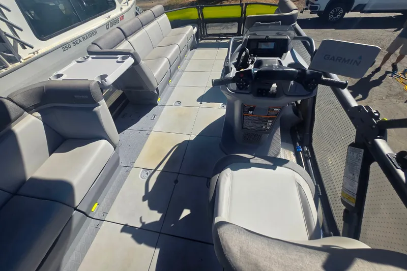 Slide: The Image of 2023 Sea-Doo Switch Cruise 21 interior with seating and Garmin navigation system. - 8