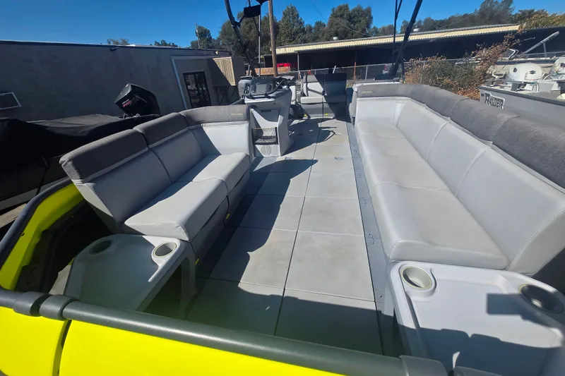 Slide: The Image of 2023 Sea-Doo Switch Cruise 21 interior with spacious seating and cup holders. - 15