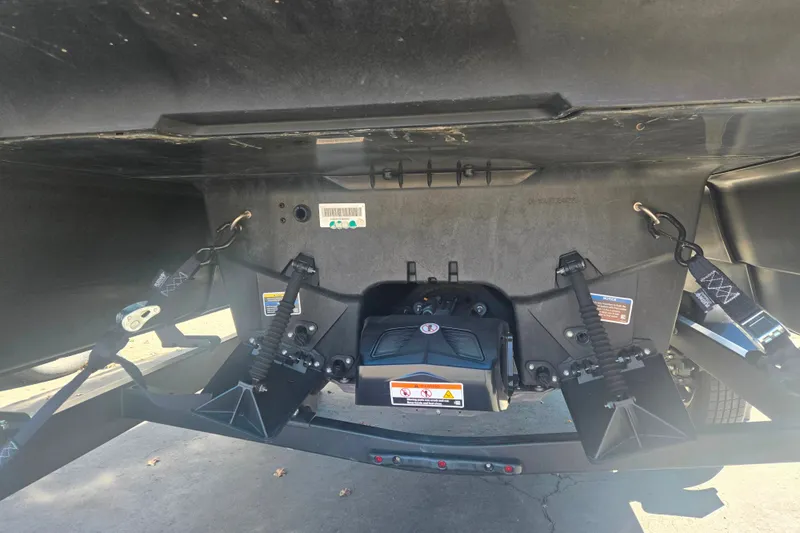 Slide: The Image of Underneath view of a 2023 Sea-Doo Switch Cruise 21, showcasing its mechanical components. - 2