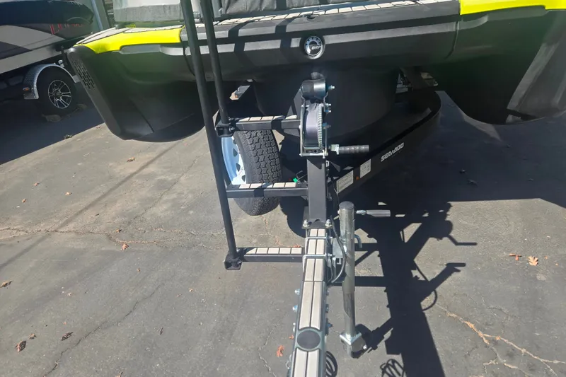 Slide: The Image of 2023 Sea-Doo Switch Cruise 21 trailer hitch and support system in a driveway. - 21