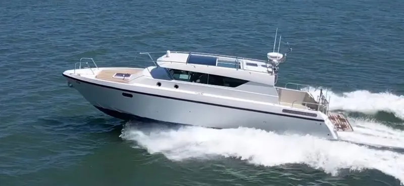 Slide: The Image of A 2013 Delta Powerboats 40 Walk Around cruising swiftly on the water. - 30